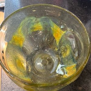 Yellow pinched glass bowl 7” across, 5 1/4” tall. Signed Paul Marshall 75.